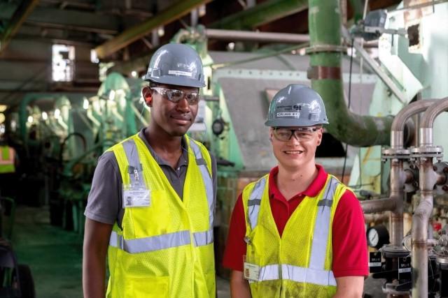 Early career employees smiling